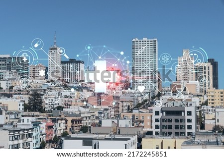 Panoramic cityscape view of San Francisco financial downtown at day time from rooftop, California, United States. Health care digital medicine hologram. The concept of treatment and disease prevention