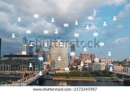 Aerial panorama city view of Philadelphia financial downtown at day time, Pennsylvania, USA. Glowing Social media icons. The concept of networking and establishing new connections between people