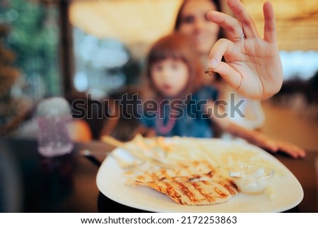 
Customer Finding a Fly in the Plate at the Restaurant. Clients of a diner having a shocked reaction after unsanitary serving of their meal
 Royalty-Free Stock Photo #2172253863