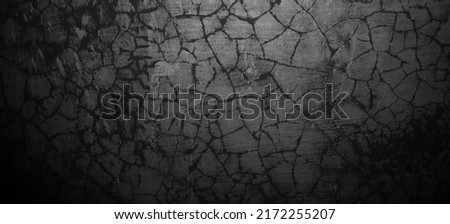 Scary black grunge goth design. horror black background. Scary dark walls, slightly light black concrete cement texture for background. Royalty-Free Stock Photo #2172255207