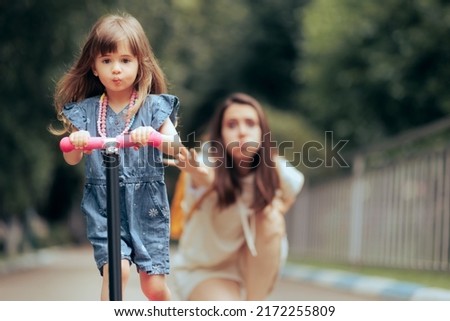 
Stressed Overprotective Mom Stopping her Kid on a Scooter. Mother obsessed with control practicing helicopter parenting style 
 Royalty-Free Stock Photo #2172255809