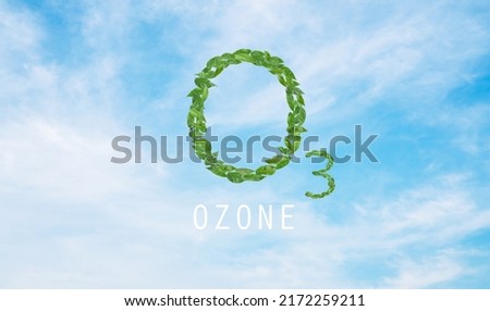 Ozone design with green leaves on blue sky background.World ozone day. Royalty-Free Stock Photo #2172259211