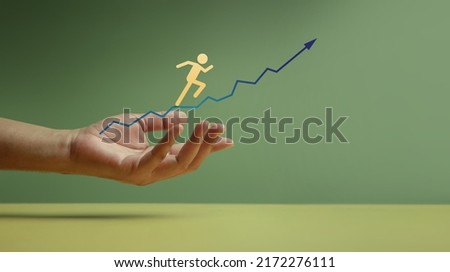 Customer Journey, Business Success Concept. Hand Gesture Supporting Client, Shareholder, Partnership or Employee Jumping Forward on Arrow Up from Low to High Royalty-Free Stock Photo #2172276111