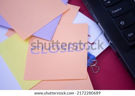 Closed. Text on adhesive note paper. Event, celebration reminder message.