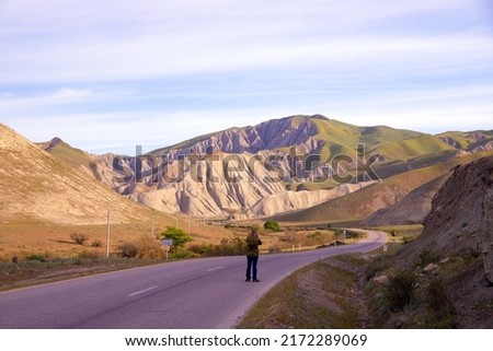 Photographer takes pictures of beautiful mountains. Khizi. Azerbaijan.