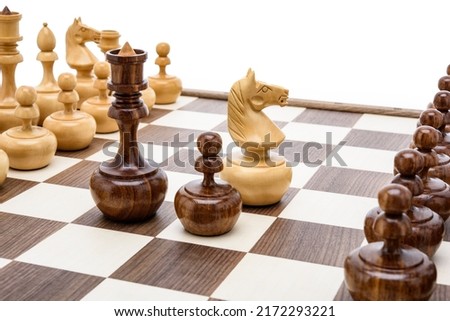 Beige Brown Wooden chess different pieces figures standing on chessboard. Close up game concept competition, Classic Tournament.