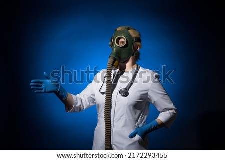 doctor woman in a gas mask and gloves extended her hand to say hello on a blue background