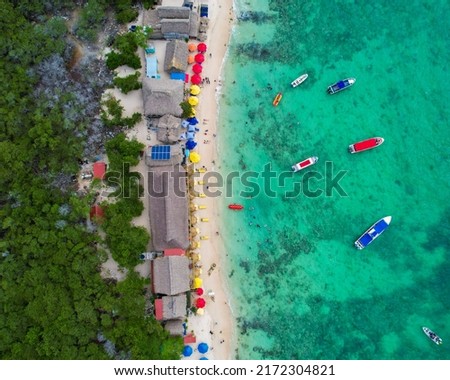 Drone picture of sea and beach with boats in summer of Cartagena Colombia