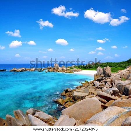 Anse Marron beach with big granite stones in La Digue Island, Seychelles. Tropical landscape with sunny sky. Royalty-Free Stock Photo #2172324895