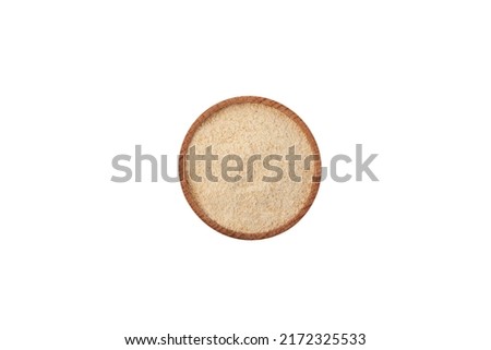 Pine Kernel Flour in wooden bowl on white background, top view. Design element. Real pine kernel nuts, dried powder.