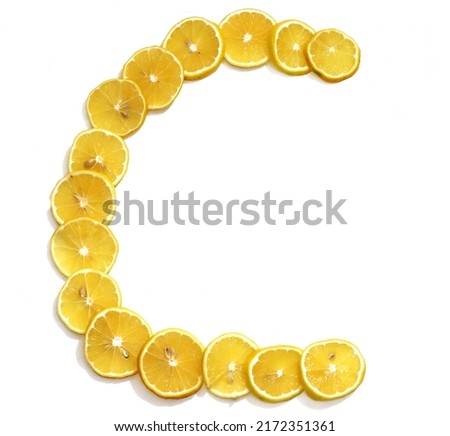 Letter C made with citrus fruits on white background as vitamin representation, top view.Letter C made with citrus fruits  on white background as vitamin representation, top view. Lemon letter. Royalty-Free Stock Photo #2172351361