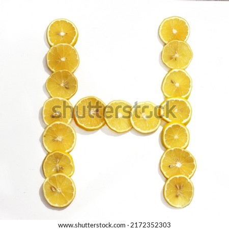 Letter H made with citrus fruits on white background as vitamin representation, top view.Letter C made with citrus fruits  on white background as vitamin representation, top view. Lemon letter. Royalty-Free Stock Photo #2172352303