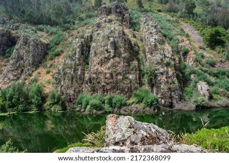 Livraria do Mondego rock formation natural monument with river in the center, Penacova PORTUGAL Royalty-Free Stock Photo #2172368099