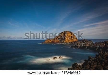 Beautiful nature landscape with Atlantic Ocean and lava rock natural swimming pools in Porto Moniz, Madeira, Portugal. Long exposure picture, october 2021