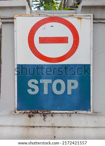 stop sign or symbol. hanging on the wall.