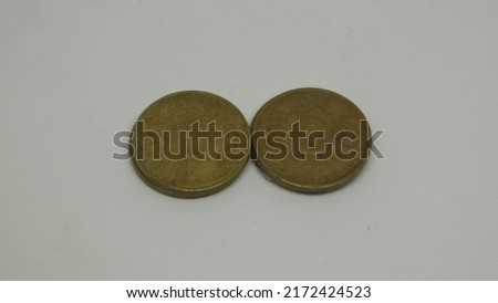 Indonesian coins worth 500 rupiah with a picture of a jasmine flower, circulated in 2003