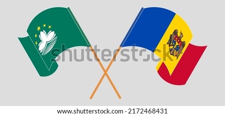 Crossed and waving flags of Macau and Moldova. Vector illustration
