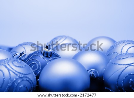 blue christmas baubles over a light background