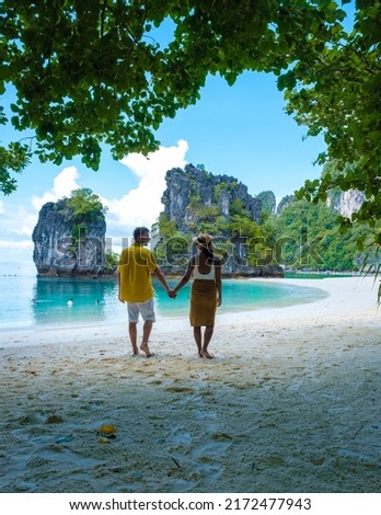Koh Hong Island Krabi Thailand, a couple of men and women on the beach of Koh Hong, a tropical white beach with Asian women and European men in Krabi Thailand Royalty-Free Stock Photo #2172477943