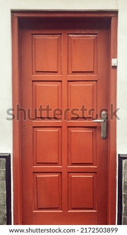 antique house door made of wood covered with a termite-resistant wood