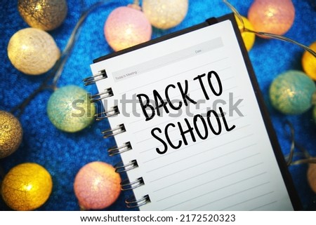 Back to School text message on notepad background
