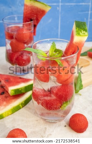 Sparkling water with frozen watermelon and mint