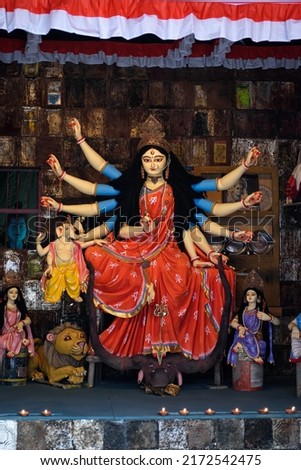 Idol of Goddess Devi Durga at a decorated puja pandal in Kolkata, West Bengal, India. Durga Puja is a famous and major religious festival of Hinduism that is celebrated throughout the world. Royalty-Free Stock Photo #2172542475