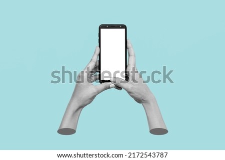 Mobile phone with white screen in female hands isolated on blue background. Blank with an empty copy space. Mockup of a smartphone. 3d trendy collage in magazine style. Contemporary art. Modern design Royalty-Free Stock Photo #2172543787