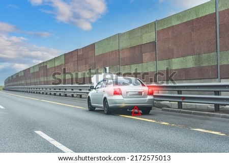Problem with vehicle. car on the emergency lane, breakdown on the highway. Faulty car on emergency stopping lane on the roadside. Royalty-Free Stock Photo #2172575013