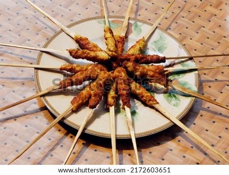 Sate Lilit is one type of famous satay in Bali. Satay wrapped can be made from sea fish or fine ground meat plus seasoning and then wrapped around and roasted, but some are mixed with young coconuts