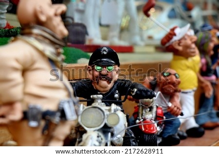 Creative layout of a police doll in suits shot on the doll store.