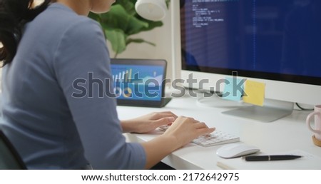 Asia young business woman sit busy at home office desk work code on desktop PC reskill upskill for job career remote self test IT deep tech ai design skill online html text for cyber security. Royalty-Free Stock Photo #2172642975
