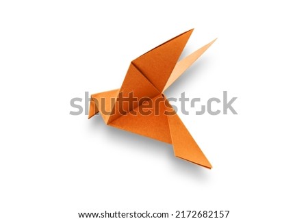 Orange paper dove origami isolated on a blank white background.