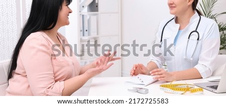 Overweight mature woman consulting with nutritionist in clinic. Banner design
