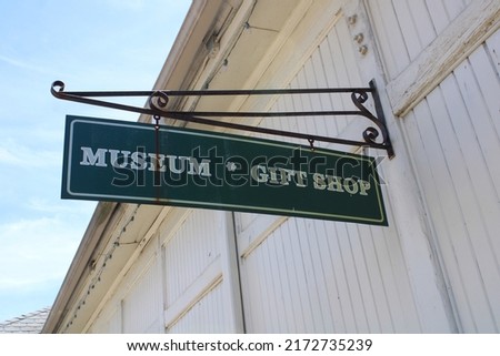 A gift Shop sign to a small museum 