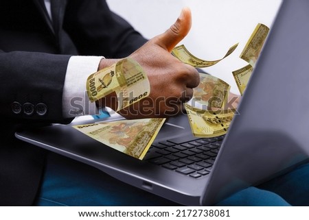 5000 Sri Lankan rupee notes coming out of laptop with Business man giving thumbs up, Financial concept. Make money on the Internet, working with a laptop