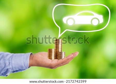 Close up photo of stacked coins and car as a symbol of vehicle buy. Concept of buying dream car. Selective focus