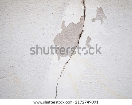 Cracks in the walls of the house. closeup photo, blurred.