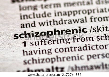 Close up photo of the word schizophrenic in a dictionary book Royalty-Free Stock Photo #2172764889