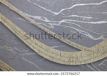 Grey fabric tapestry background with a modern repeat patterns and textures