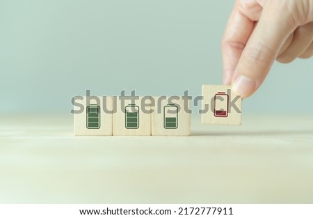 Burnout syndrome at work concept. Low energy battery. Emotional, physical, and mental exhaustion caused by excessive, prolonged stress. Decreased motivation, lowered performance and negative attitudes Royalty-Free Stock Photo #2172777911