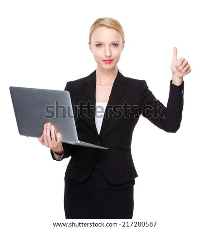 Caucasian businesswoman with laptop and thumb up