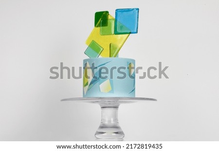 Graphic design cake on a white background.