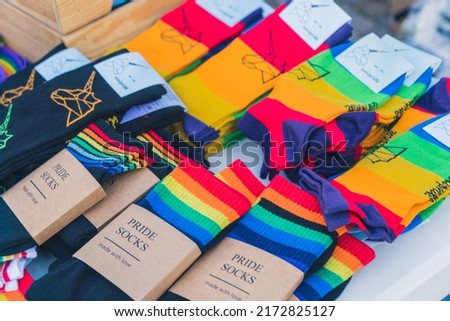 Cute accessories for LGBTQAI community members. Rainbow socks representing queer colors. High quality photo