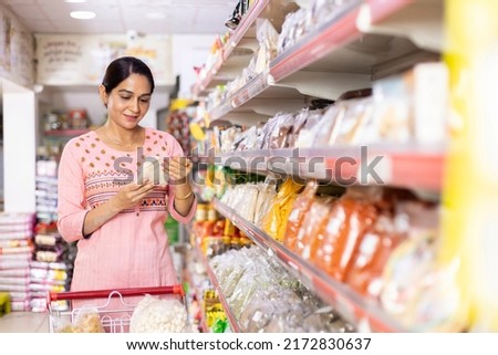 Indian woman shopping at grocery store