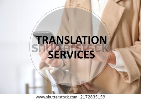 Translation services. Young woman using modern smartphone indoors, closeup