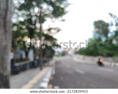 Blurred empty road with trees on the side walk in the morning as a part of outdoor photography