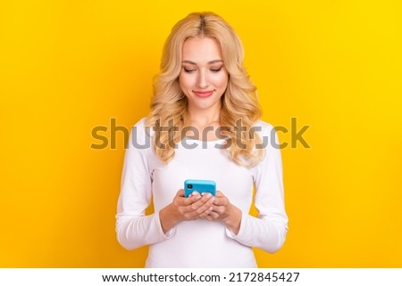 Photo of cute millennial blond lady look telephone wear trend cloth isolated on yellow color background