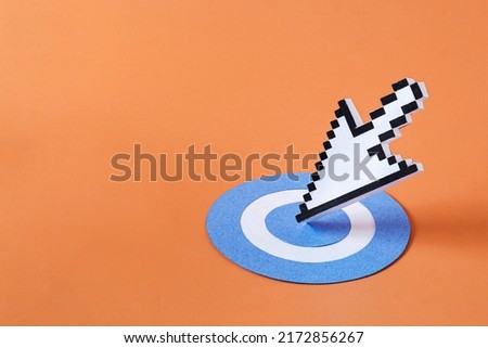 Pixel digital arrow mouse pointer modern technology as the arrow hit the target. Minimal creative concept with copy space. Royalty-Free Stock Photo #2172856267