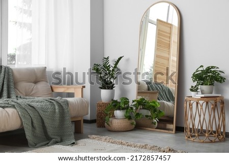 Beautiful room interior with leaning floor mirror Royalty-Free Stock Photo #2172857457